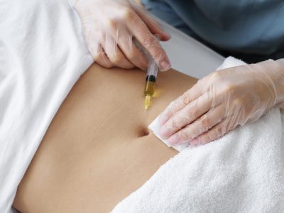 high-angle-healthcare-professional-injecting-belly-min